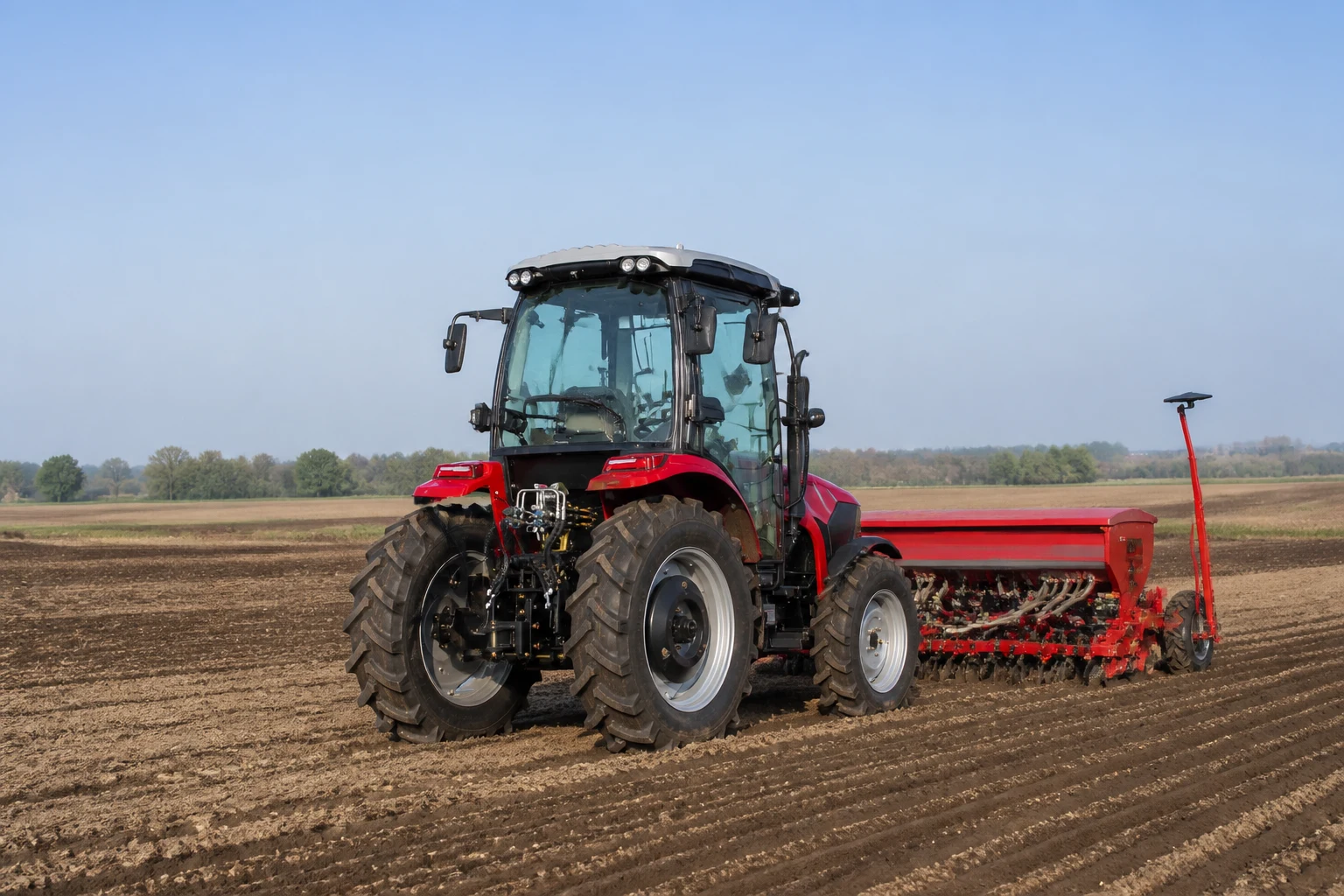 Tractor seeding and planting in agricultural field
